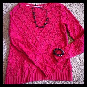 Red cable knit sweater
